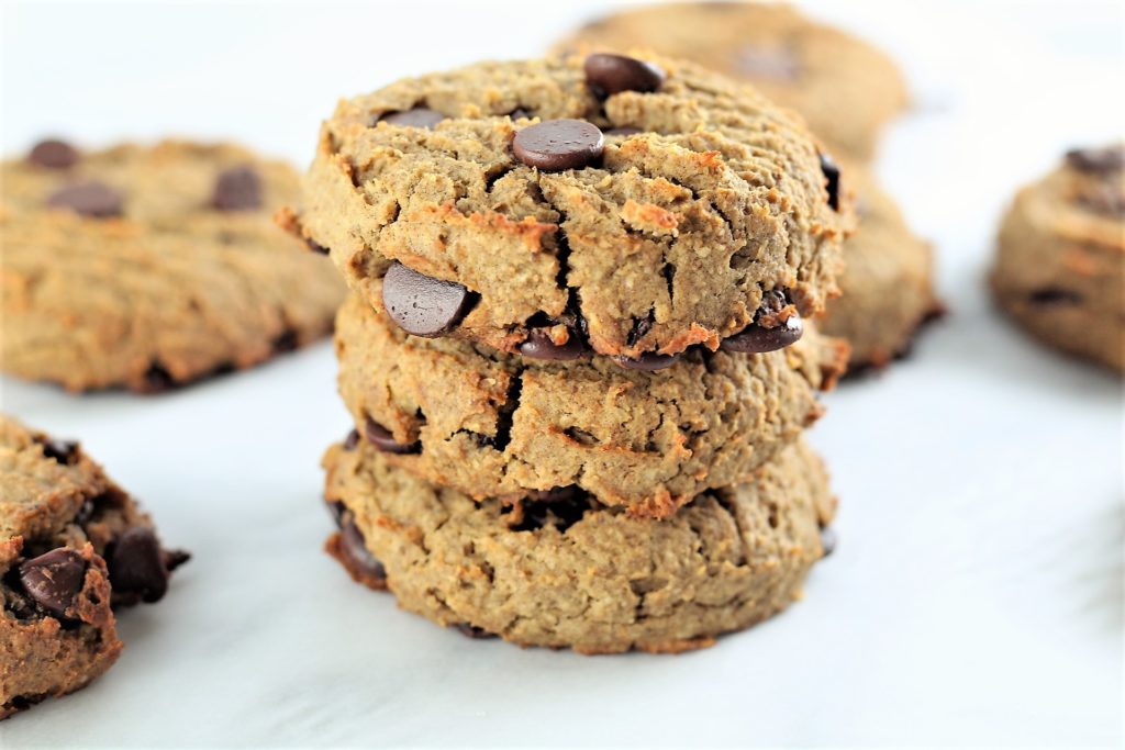 oatmeal chocolate chip high protein cookies 3 stacked on counter
