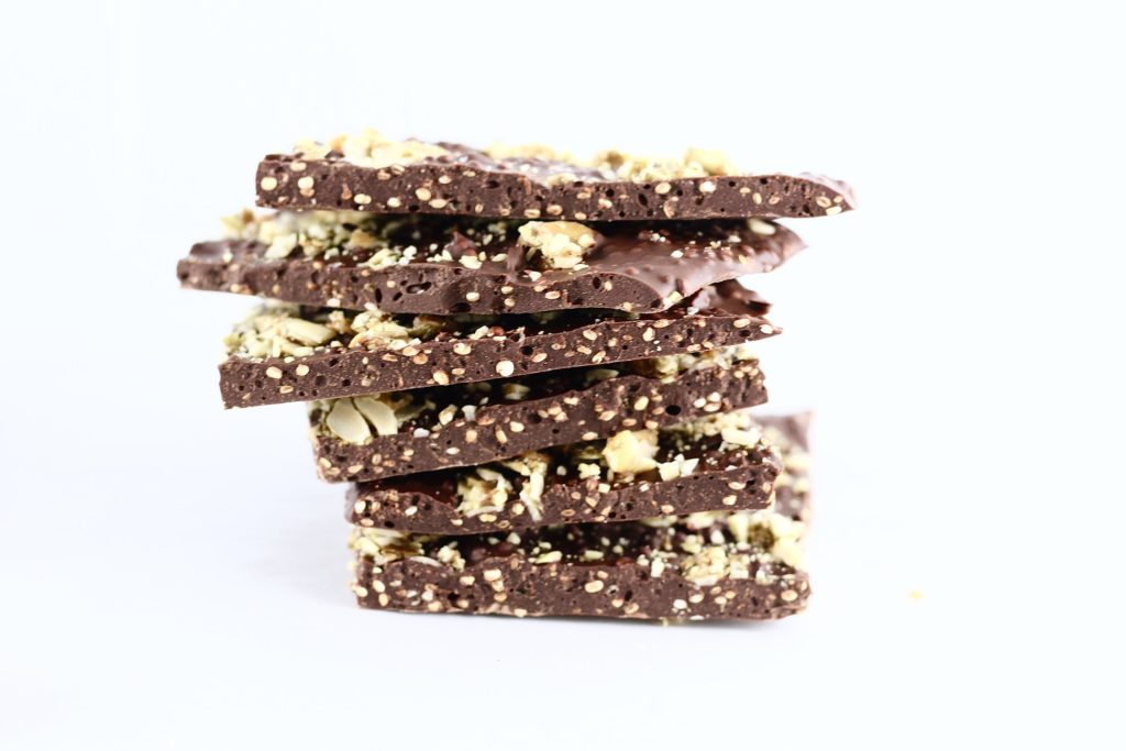 homemade, stacked chocolate bark with pumpkin seed topping