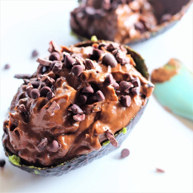 avocado cacao mousse | Milk & Honey Nutrition avocado cacao mousse in avocado skin with chocolate chips