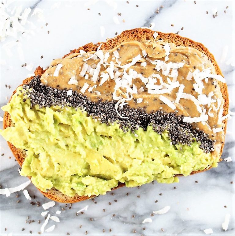 avocado peanut butter toast | Milk & Honey Nutrition avocado peanut butter toast with half avocado, half peanut butter separated by chia seeds