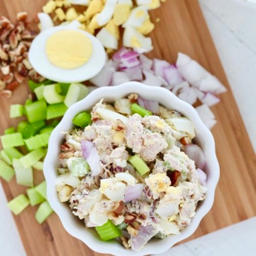 tuna salad with egg 3 | Milk & Honey Nutrition tuna salad on cutting board with hard boiled egg onion and celery