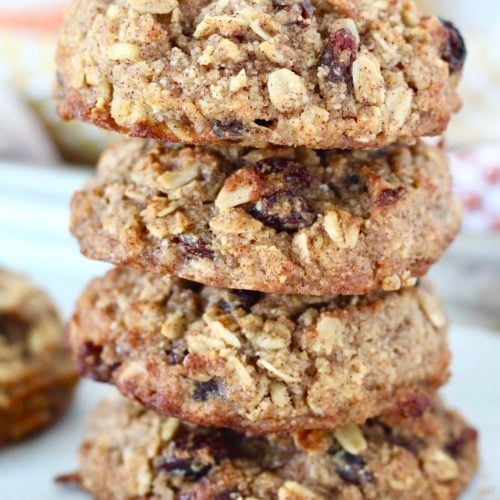 Easy Oatmeal Breakfast Cookies 4 | Milk & Honey Nutrition stack of oatmeal raisin breakfast cookies on bakers cooling rack