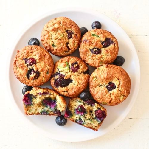 Gluten Free Blueberry zucchini muffins 1 | Milk & Honey Nutrition blueberry zucchini muffins on white plate