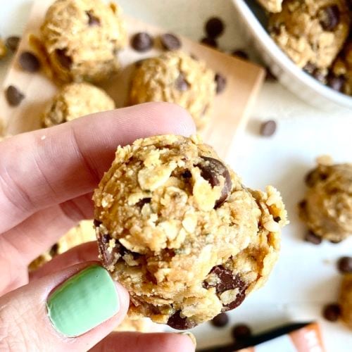 Chocolate Caramel Oatmeal Protein Balls 1 | Milk & Honey Nutrition hand with green nail polish holding oatmeal protein balls is oatmeal good for diabetes?