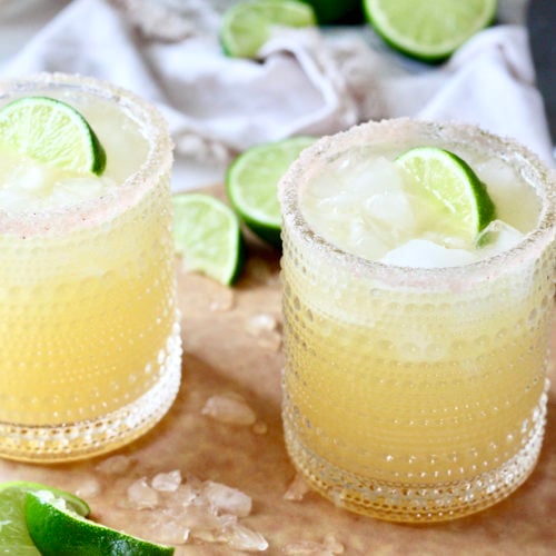 skinny margarita 1 | Milk & Honey Nutrition two skinny margaritas with lime wedges on cutting board