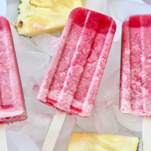 pineapple cherry popsicles 9 | Milk & Honey Nutrition pineapple cherry popsicles and pineapple slices in bowl of ice