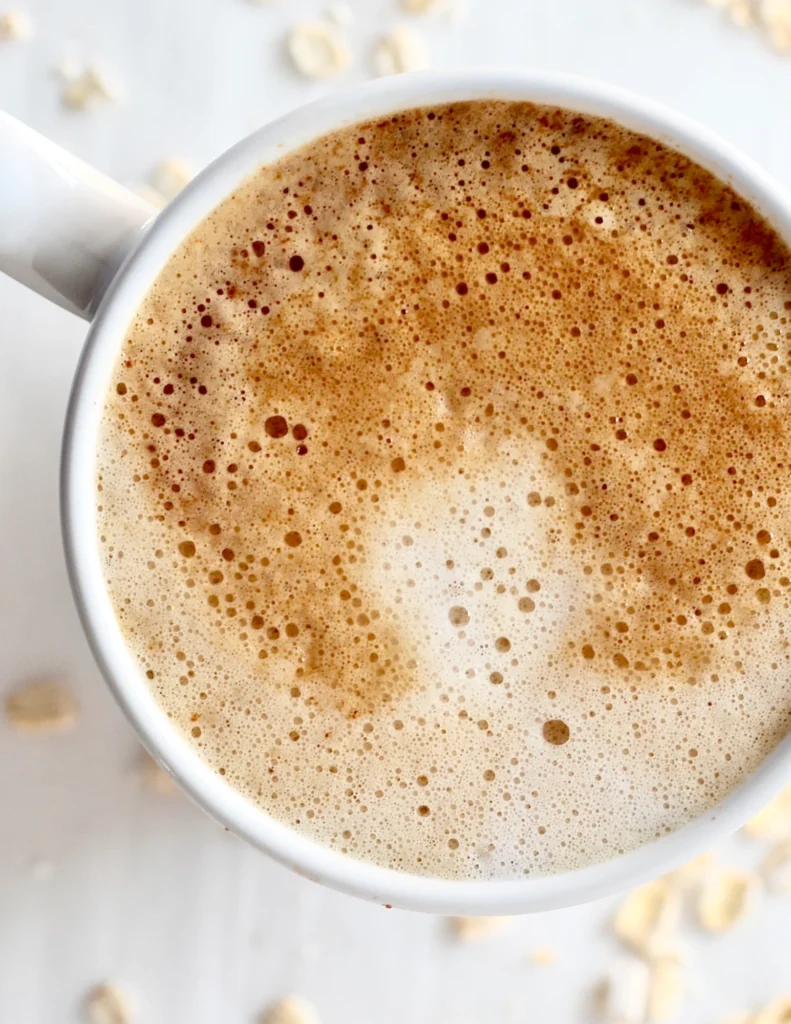 low sugar oat milk latte in coffee mug