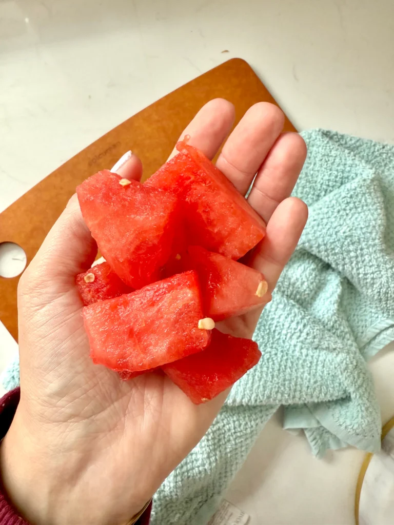 watermelon cubes in hand