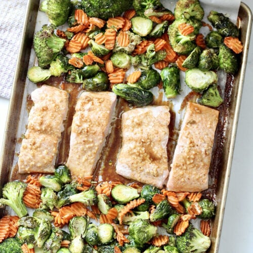 maple dijon roasted salmon 3 | Milk & Honey Nutrition maple dijon roasted salmon on a sheet pan with veggies