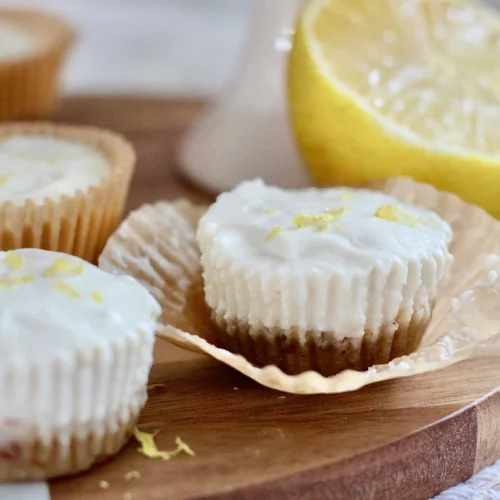 No Bake Cottage Cheese Lemon Cheesecake Bites 7 | Milk & Honey Nutrition Close-up of no-bake cottage cheese lemon cheesecake bites with creamy filling and almond-pecan crust.